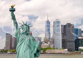 New York City tourism concept. Statue of Liberty with Lower Manh
