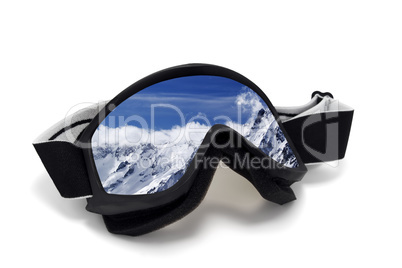 Ski goggles with reflection of cloudy mountains