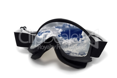 Ski goggles with reflection of cloudy mountains