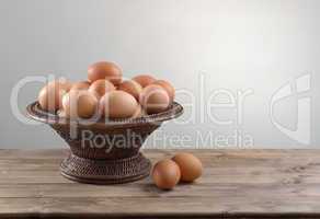 hicken eggs in a wicker bowl