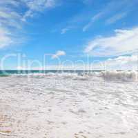 ocean, sandy beach and blue sky