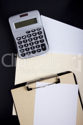 Calculator with office paper