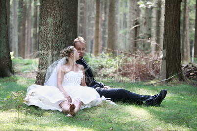 Bride and groom in forest