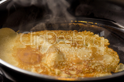 crepe baking in pan