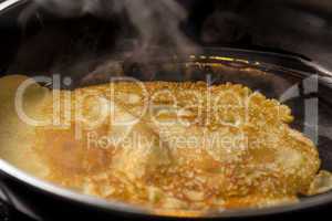 crepe baking in pan