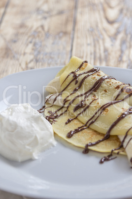 crepe with banana and chocolate sauce