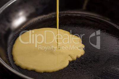 Pancake batters pouring in pan