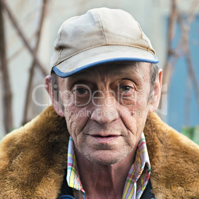 Portrait of a elderly man outdoors closeup