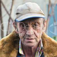 Portrait of a elderly man outdoors closeup