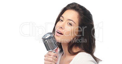 Preety woman singing into a microphone