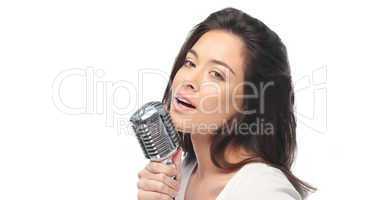 Preety woman singing into a microphone