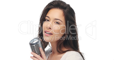 Preety woman singing into a microphone