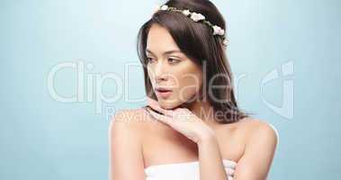 Sensual Woman Looking Left on Sky Blue Background
