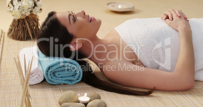 Long Hair Young Woman Lying Down in a Spa
