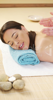 Pretty woman enjoying a lava stone massage