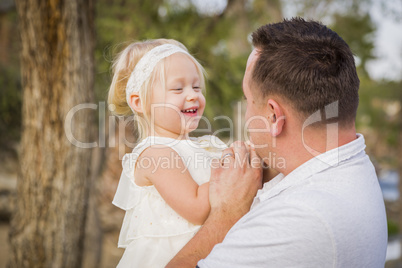 Father Playing With Cute Baby Girl Outside at the Park