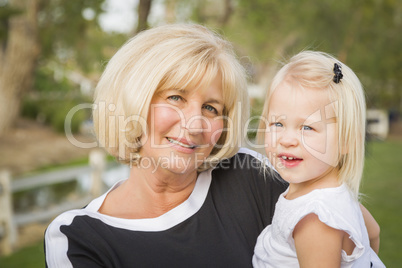 Grandmother and Granddaughter Playing At The Park