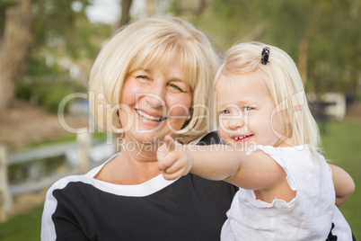 Grandmother and Granddaughter Playing At The Park