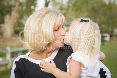 Grandmother and Granddaughter Playing At The Park