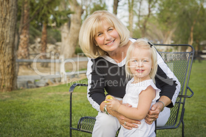 Grandmother and Granddaughter Playing At The Park