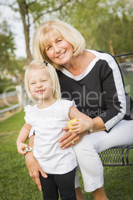 Grandmother and Granddaughter Playing At The Park