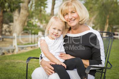 Grandmother and Granddaughter Playing At The Park