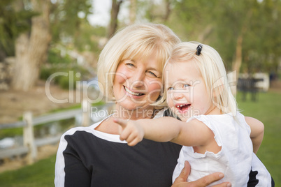 Grandmother and Granddaughter Playing At The Park