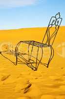 table and seat in desert  sahara   yellow sand