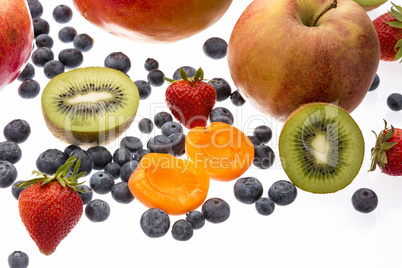 Halved Apricot And Kiwi Amidst Other Fruit