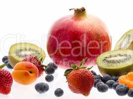 Halved Kiwi Fruits And Berries On White Background