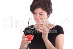 Woman checking tomato