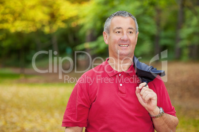 Gray-haired man in the autumn walk
