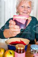 Granny proudly displays her homemade jam