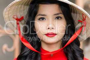 Pretty Vietnamese woman in a straw hat