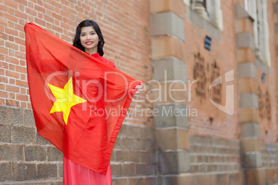 Happy patriotic young Vietnamese woman