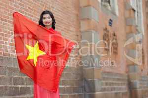Happy patriotic young Vietnamese woman