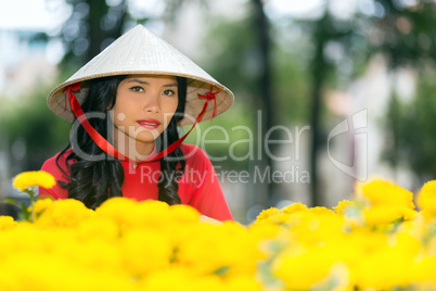 Young Vietnamese woman in a traditional hat