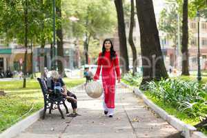 Elegant young Vietnamese woman in a park