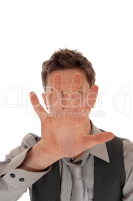 Man holding hand for face.