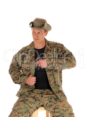 Soldier pulling his handgun.