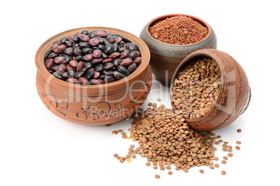 Beans, rice and lentils isolated on white background