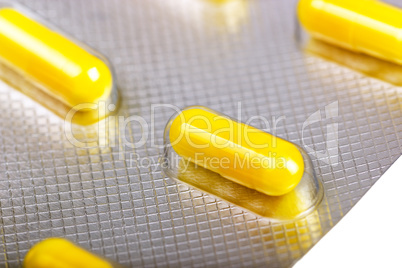 Medicine capsules packed in blisters