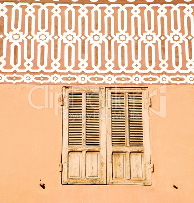 window in morocco  orange  construction wal brick historical