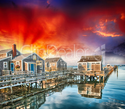 Wooden Homes over water. Beautiful view at summer sunset