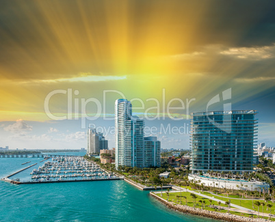 Miami skyline panorama at dusk with urban skyscrapers and cloudy