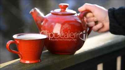 Red teapot with teacup