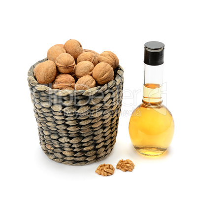walnuts and oils isolated on white background