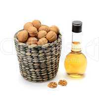 walnuts and oils isolated on white background