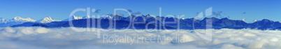 Aerial view on Alps mountains upon clouds, seen from upon Fribourg, Switzerland