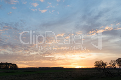 Sunset over a field in Denmark in autumn